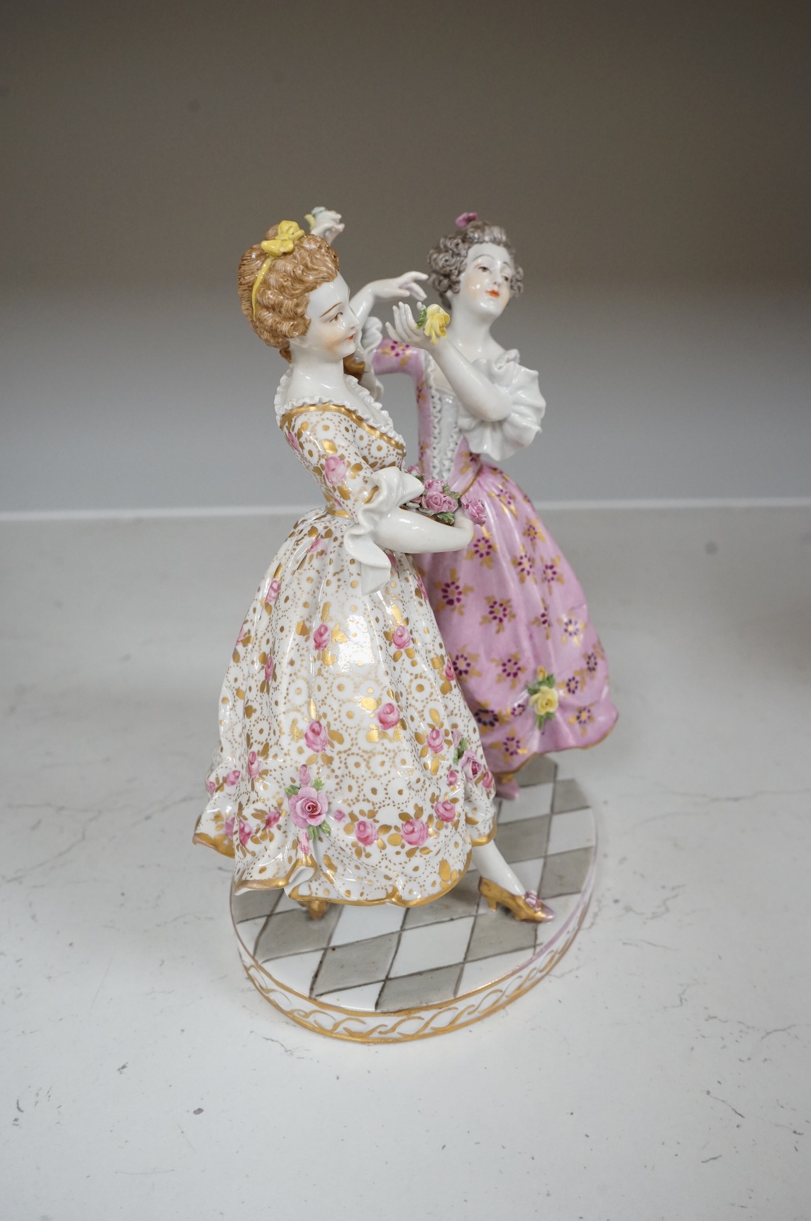 A Continental porcelain group of two dancers, 20cm high